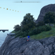 A screenshot shows a far off Sonic standing on a cliff near the ocean.